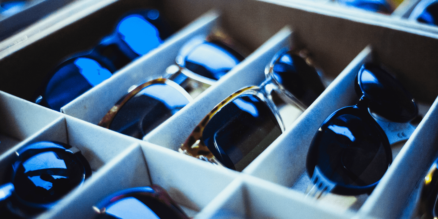 different sunglasses on eyeglass display presentation tray